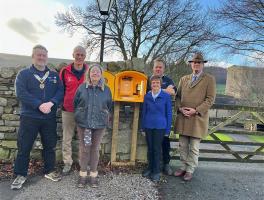 President Paul Hardcastle with Delia Hardcastle and other supporters at the launch of the defibrullator